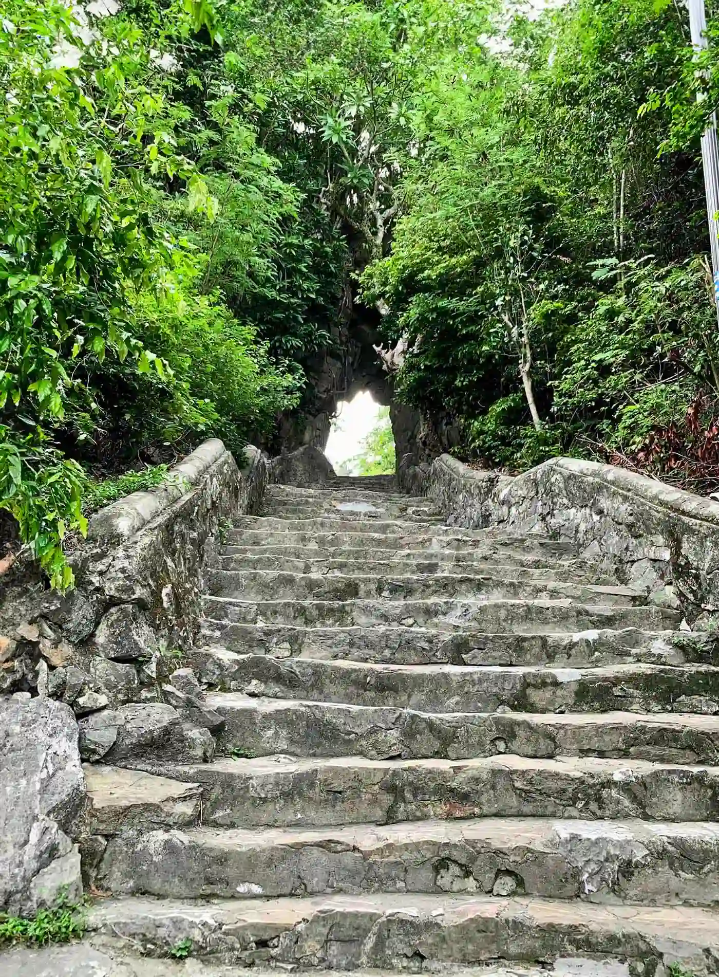 Climb the stairs at Marble Mountains