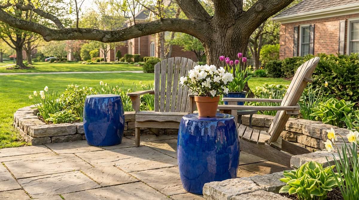 A set of cobalt ceramic side tables with a high-shine glazed finish, perfect for outdoor spring decor. These waterproof garden stools function as side tables or plant stands, adding jewel-tone intensity and reflecting nearby florals to enhance color impact in seating areas.