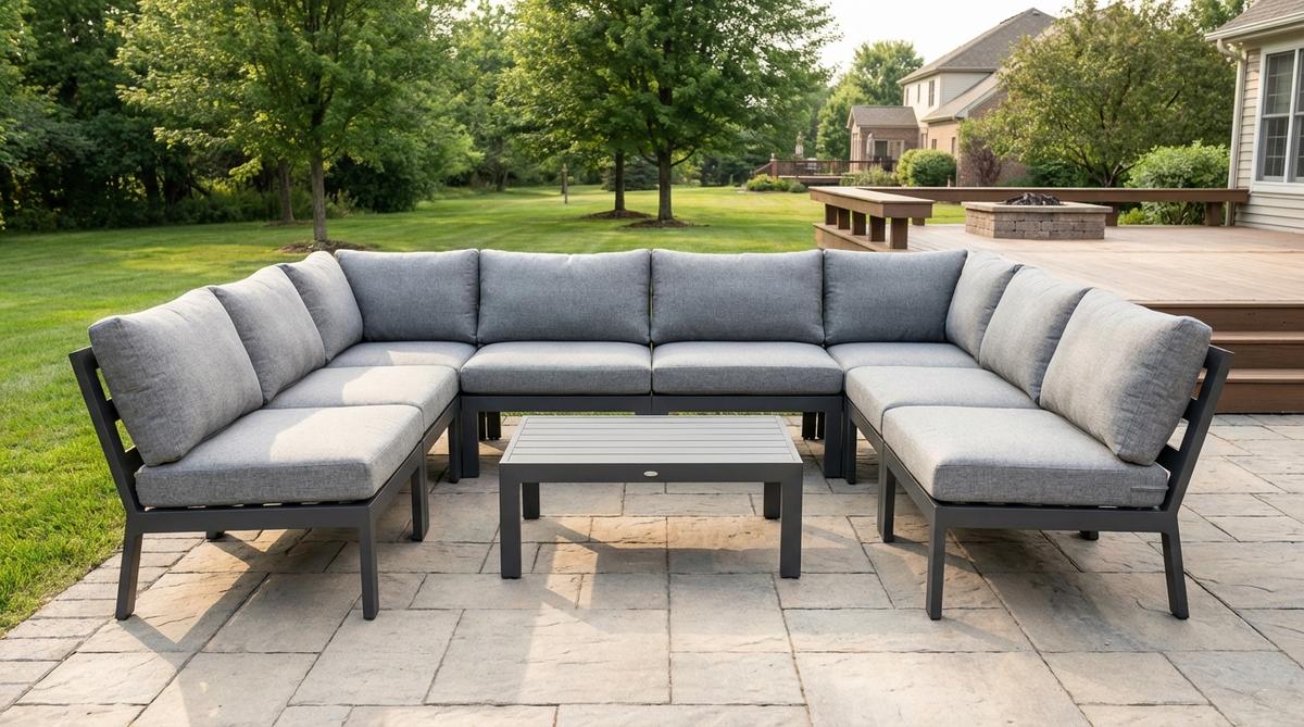 Modern garden furniture featuring a six-piece aluminum frame sectional with powder-coated matte charcoal finish, contoured deep-fill cushions with memory foam cores, and quick-dry outdoor fabric. Modular design allows flexible L-shape or U-configuration arrangements for intimate gatherings or larger parties.